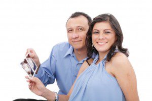 Couple holding an ultrasound photo